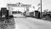 Surveyor A. C. Hart photographing county line