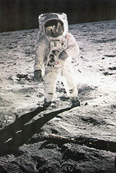 Astronaut Aldrin's faceplate reflecting Neil Armstrong on the moon
