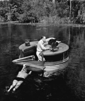 Newton Perry propelling cameraman Russ Erving and underwater filming setup - Wakulla Springs, Florida.