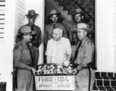 President Harry S. Truman receiving fresh fruit from Florida Highway patrolmen - Key West Florida.