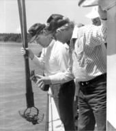 Jim Smith and Dempsey Barron look at their oysters - Apalachicola, Florida.