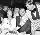 Florida Governor Bob Graham working as a waiter serves dinner