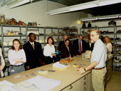 Archaeologist Dave Dickel talking to members of the House Transportation and Economic Development Appropriations Committee during a tour of the R.A. Gray building.