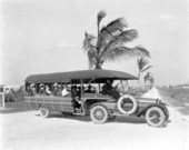 Group of visitors riding in land developers' tour bus - Hialeah, Florida