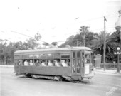 A streetcar filled with passengers running on the track - Tampa, Florida