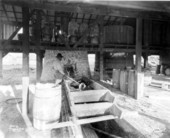 A worker making turpentine in the Wauchula Turpentine Still - Wauchula, Florida