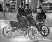 Three men with an Oldsmobile Curved Dash Runabout.