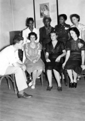 Dr. Coughlin, Director of the pre-natal clinic (at left), sitting with members of the staff.