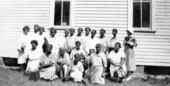 Group portrait of African American midwives during a meeting in Polk County, Florida.