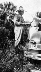 Midwife nurse showing how to use eye drops on a baby - Punta Rassa, Florida.