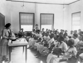 Jule Graves showing a class of midwives the contents of a model midwife bag at Florida A&M College in Tallahassee, Florida.