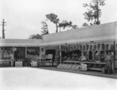 American Bakeries Company shopfront and fruit stand.