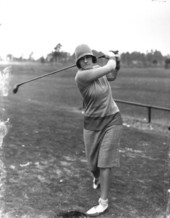 Maureen Orcutt swinging her golf club.