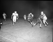 Burt Reynolds running the ball for FSU during football game against Furman University in Tallahassee, Florida.