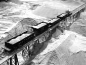 Bird's eye view showing electric railway shipping ACL cars full of phosphate to the IMC central plant for processing in Mulberry, Florida.