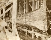 African American lumberman with large log in Apalachicola, Florida.