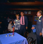 Actor Anthony Quinn posing with an unidentified woman at a restaurant - Fort Lauderdale, Florida