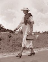 View of Izzelly Hardin, mid-wife, walking on the road - Riviera Beach, Florida.