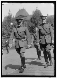 General Pershing and members of the American Expeditionary Forces walking.