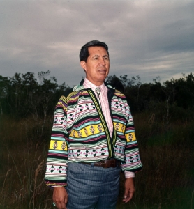 Miccosukee Chief Buffalo Tiger standing in a field.