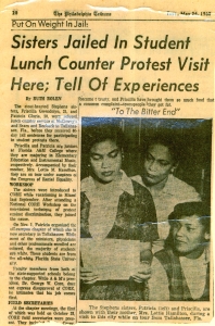 Page from the Philadelphia Tribune newspaper with a photograph of Patricia and Priscilla Stephens and their mother Lottie Hamilton looking at a piece of paper.