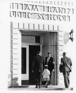 Six-year-old Ruby Bridges being escorted to the formerly white-only William Frantz Elementary School in Louisiana by U.S. Marshals.