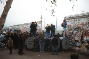 A crowd of West German citizens gathered at the newly created opening in the graffiti-covered Berlin Wall at Potsdamer Platz.