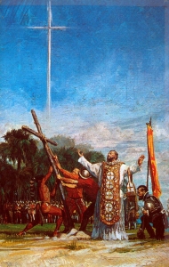 Painting of a Spanish priest on a beach, the conquistador Don Pedro Menendez de Aviles, and a group of men including one Native man raising a wooden cross.