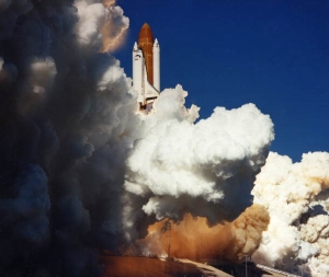 Space shuttle Challenger lifting off from Pad 30B.