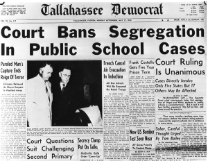 Frontpage of the Tallahassee Democrat newspaper showing the headline Court Bans Segregation in Public School Cases.