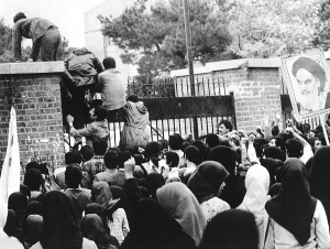 Students climbing over the gate outside the U.S. Embassy in Tehran.